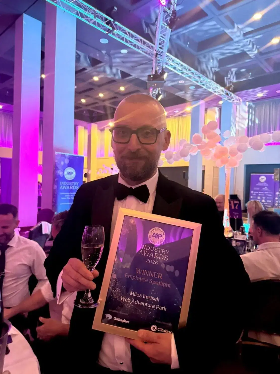 Milos wins Employee of the Year award in National Finals.